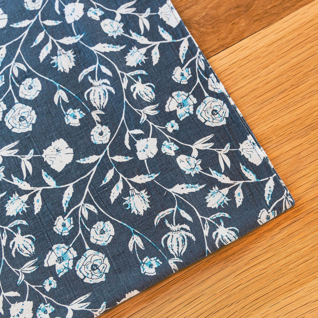 Floral patterns perfectly arranged in the Montecito Table Runner. 