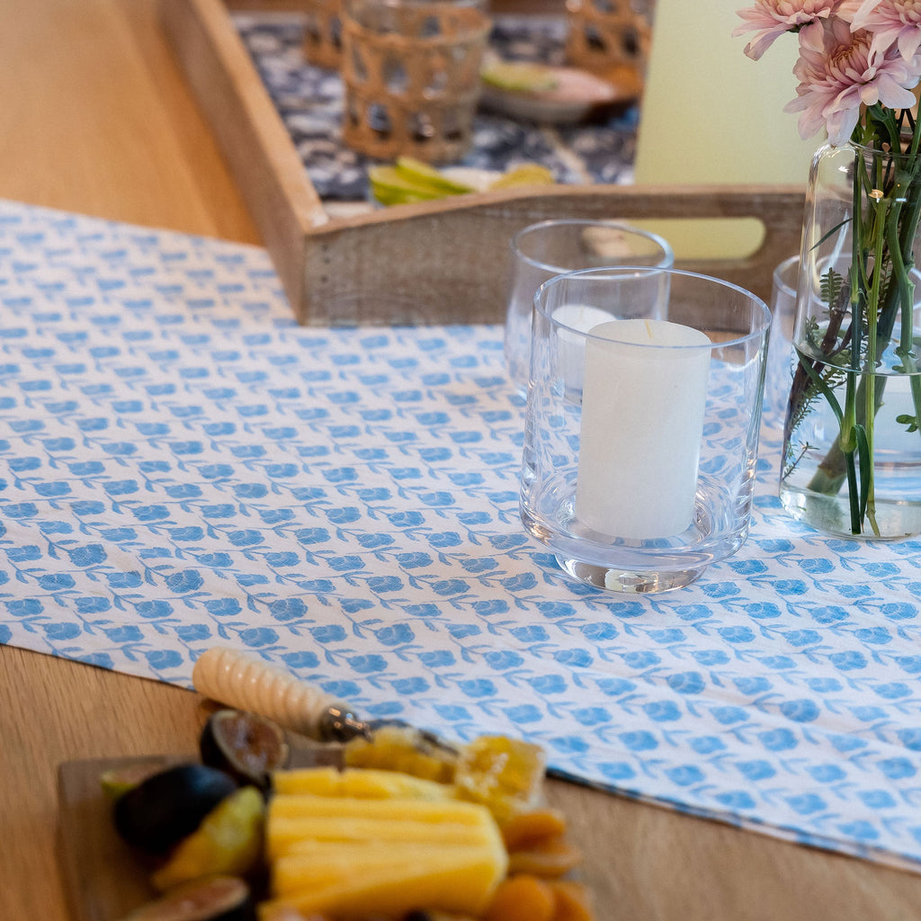 Table runner from the Del Mar collection, featuring a blue and white floral pattern guaranteed to elevate any dinner gathering.